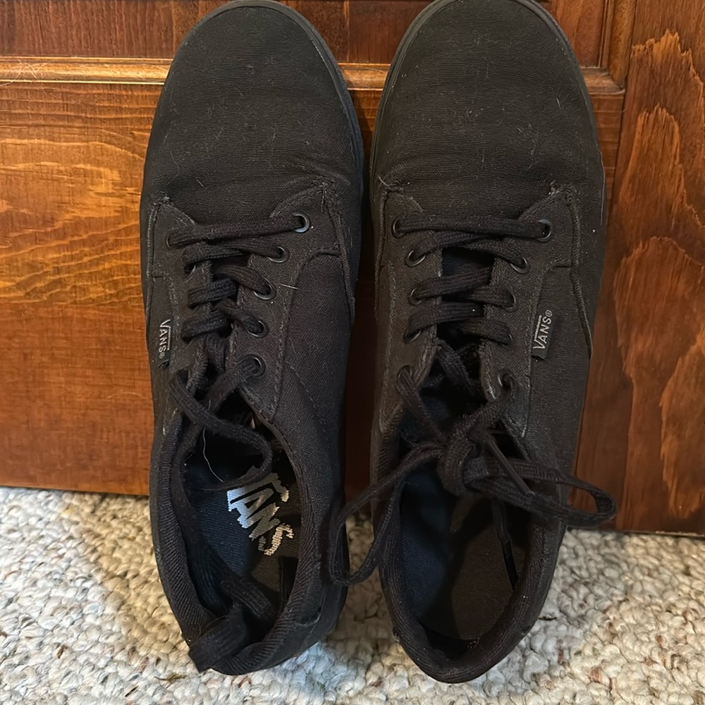 Black Vans.